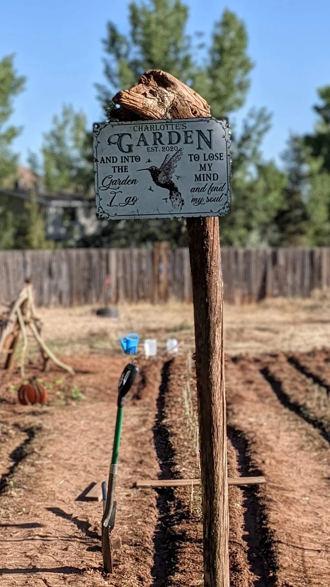 Charlotte's Garden After Tilling — This Sign Was a Gift from Beth Lock, My Mother-in-Law